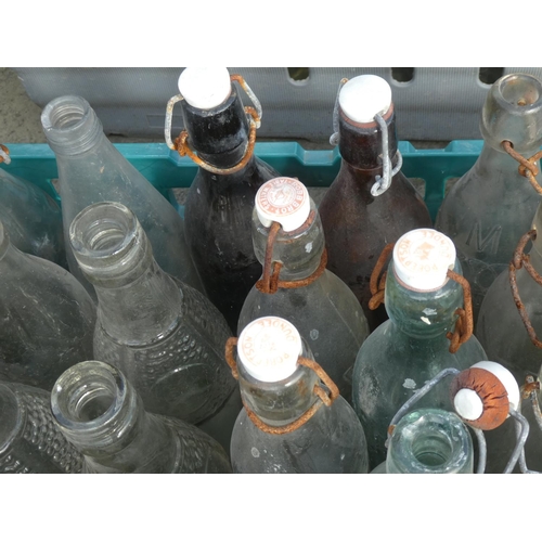 14 - A large collection of vintage glass bottles to include Robb Bro table waters.