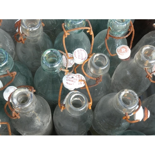 15 - A large collection of vintage glass bottles to include Robertson, Dundee.