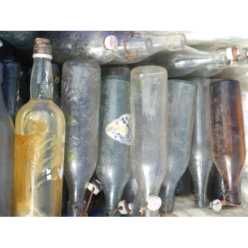 25 - A large collection of vintage glass bottles to include Robertson, Dundee.