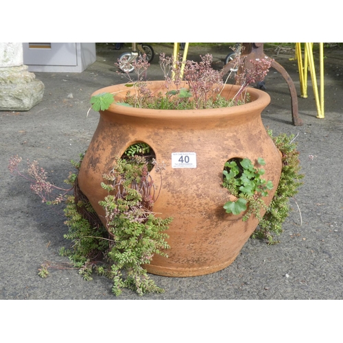 40 - A large terracotta strawberry planter.