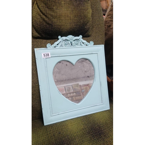 538 - Vintage light blue wooden mirror features ornate, carved detailing and a heart-shaped frame. It has ... 