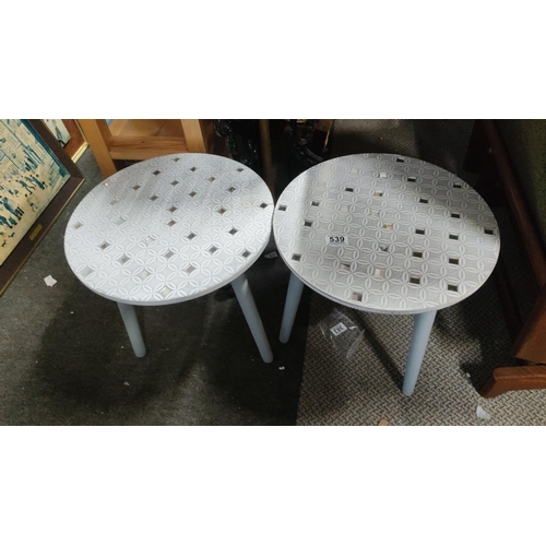 539 - Pair of modern round side tables with embossed geometric patterns and mirrored details.  Measuring 4... 