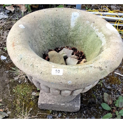 10 - Concrete garden urn with classic fluted design and a pedestal base.