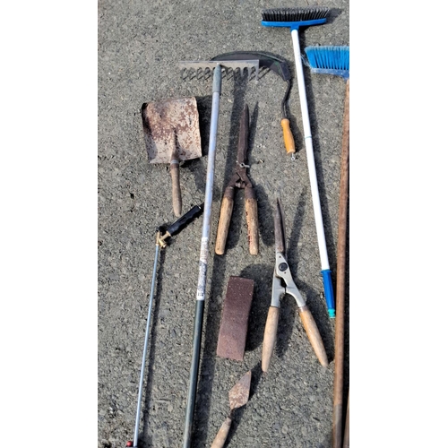 13 - Mixed lot of assorted gardening tools including shovels, rakes, shears, brooms, and hand tools.