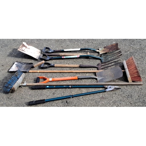 20 - Collection of garden tools including shovels, rakes, brooms, and forks featuring a Spear & Jackson 