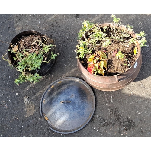 26 - Two cast iron cauldrons with handles and lid (a/f).