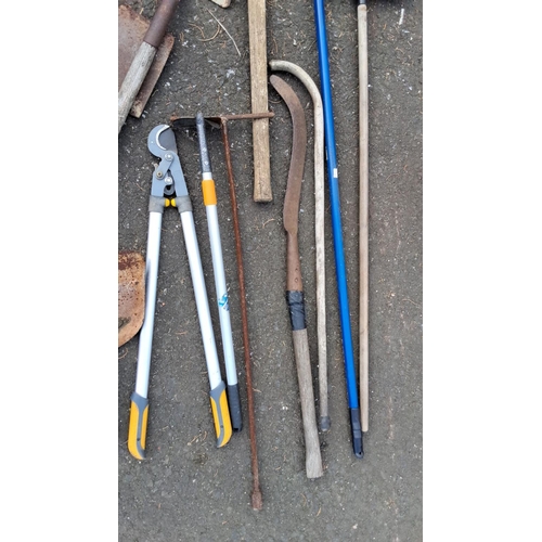 34 - Mixed lot of garden tools, including shovels, rakes, pruners, and shears. Includes Wolf-Garten TeleC... 