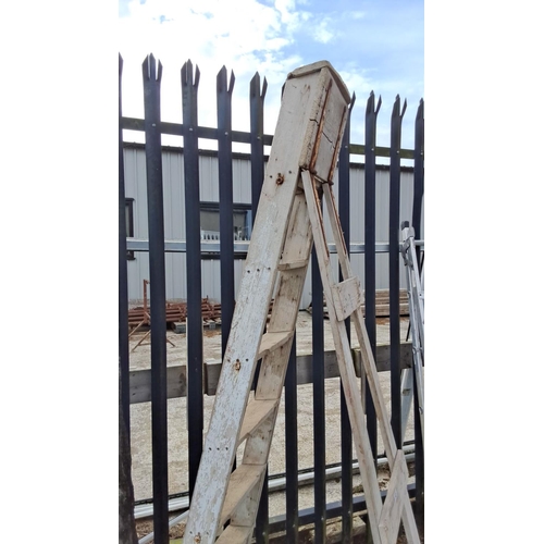 43 - Vintage wooden step ladder with sturdy metal supports.