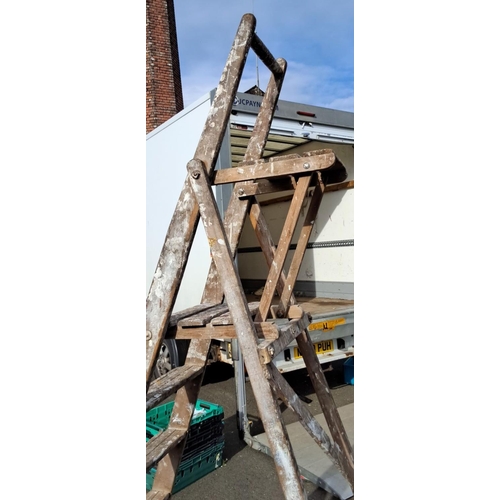 50 - Vintage wooden step ladder, from the mid-20th century. It has a rustic appearance with aged wood and... 