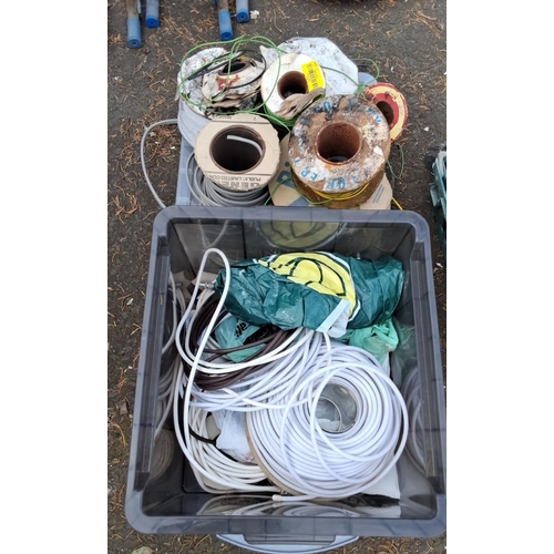 58 - Collection of assorted electrical wires and cables in spools and coils.