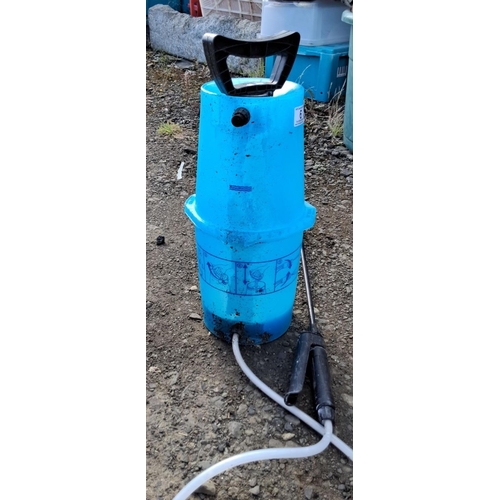 6 - Outdoor gardening lot featuring a yellow hose reel, 5L Eedo plant nutrient container, and a blue man... 