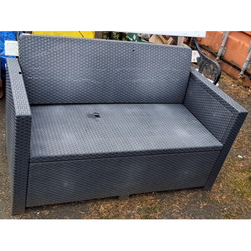 64 - Dark black rattan-style patio two seater with woven design (a/f).