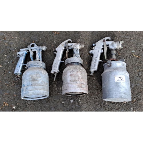 70 - Three vintage paint spray guns, consisting of two DeVilbiss models and one Defendi model.