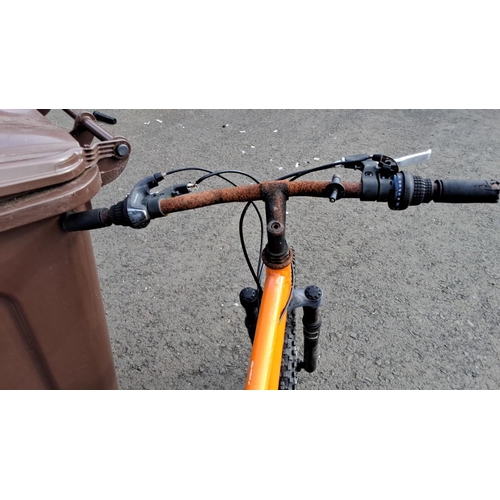 71 - Apollo Radar mountain bike features an orange frame with Shimano equipped gears and Kenda tyres (a/f... 