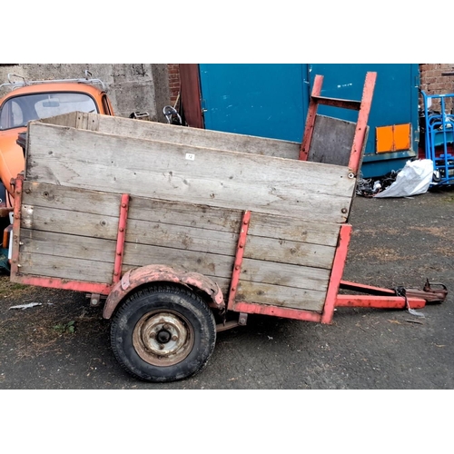 72 - Vintage wooden trailer with red metal frame, single axle.