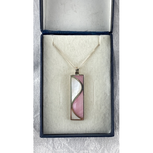 100 - Sterling silver necklace with a rectangular pendant inlaid with pink and white enamel, marked 