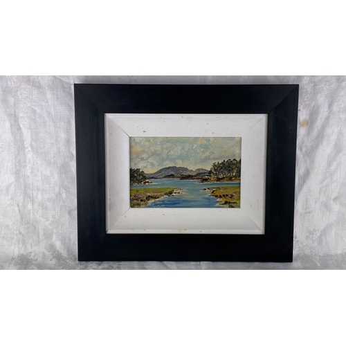 102 - Oil on board landscape painting featuring a serene coastal scene with a mountain backdrop, framed in... 