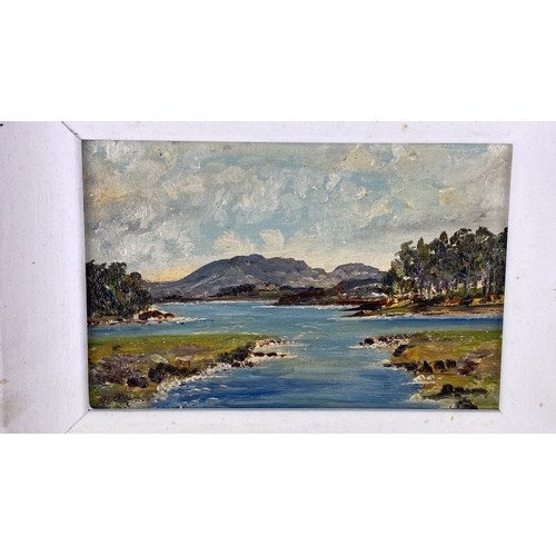 102 - Oil on board landscape painting featuring a serene coastal scene with a mountain backdrop, framed in... 