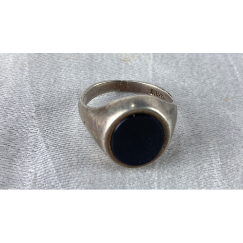 107 - Sterling silver signet ring with black onyx stone, marked 