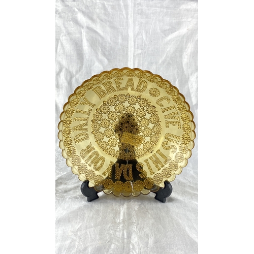 111 - Amber glass bread plate with raised floral patterns and 