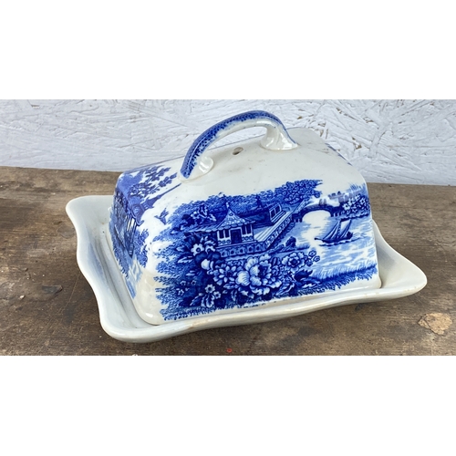 115 - vintage English porcelain cheese keeper, with a blue and white pastoral scene.