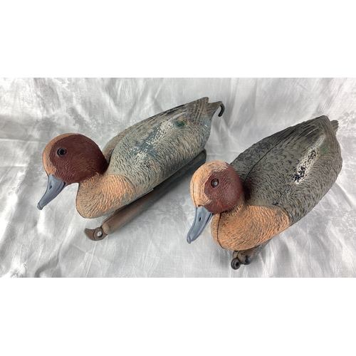 84 - Pair of vintage plastic hand painted duck decoys.