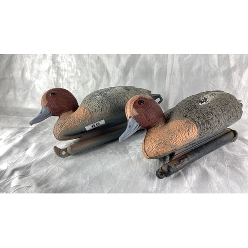 84 - Pair of vintage plastic hand painted duck decoys.