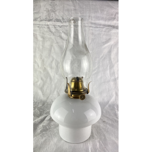 87 - Vintage glass oil lamp with a brass burner and wick adjuster marked 