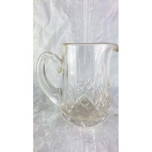 88 - A Waterford crystal jug, measuring 14cm.