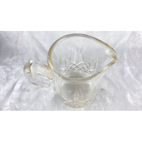 88 - A Waterford crystal jug, measuring 14cm.