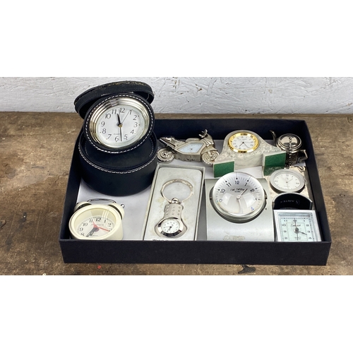 118 - Various decorative clocks, including pieces such as quartz travel clocks, vintage-style alarm clocks... 