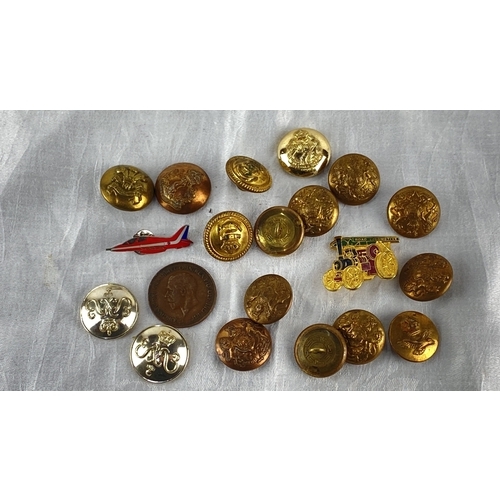 112 - Collection of vintage military buttons and enamel badges, featuring various embossed insignias and d... 