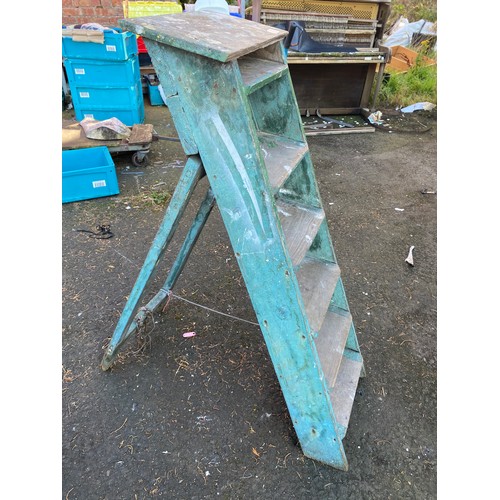 1 - A vintage wooden stepladder.