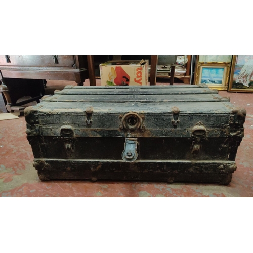 434 - Antique wooden steamer trunk with metal hardware and interior storage compartments. From the 19th to... 