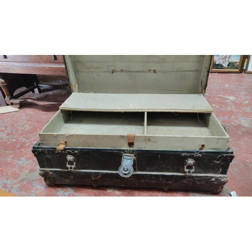 434 - Antique wooden steamer trunk with metal hardware and interior storage compartments. From the 19th to... 