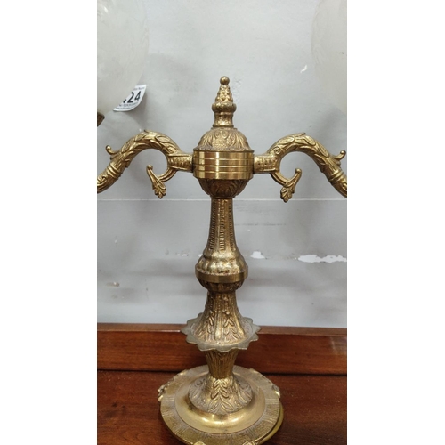 436 - Antique brass table lamp with two frosted glass shades, featuring intricate detailing and ornate des... 