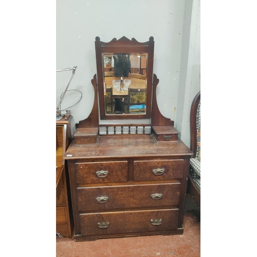 440 - Victorian mahogany dresser with attached mirror and five drawers, featuring carved brass handles and... 