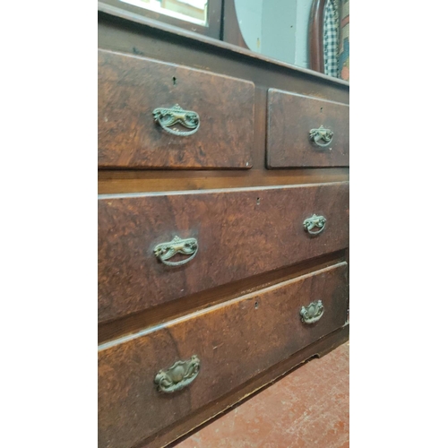 440 - Victorian mahogany dresser with attached mirror and five drawers, featuring carved brass handles and... 