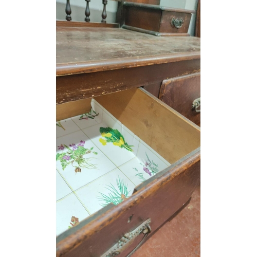 440 - Victorian mahogany dresser with attached mirror and five drawers, featuring carved brass handles and... 