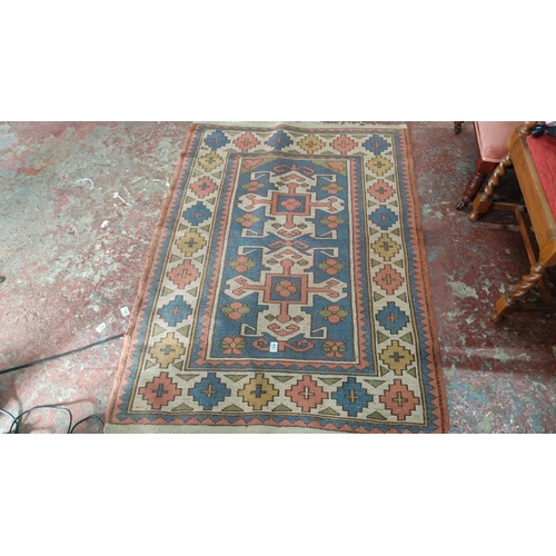 443 - Kilim rug features traditional geometric designs in a palette of blue, coral, green, and cream.