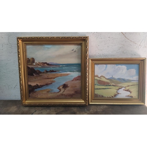 450 - A pair of framed oil paintings depict landscapes, signed by artist V. Granakey.