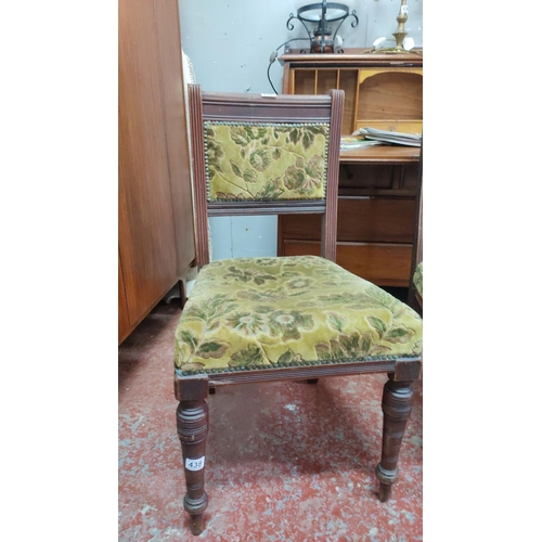 461 - Pair of Victorian dining chairs with floral upholstered seats and backs, featuring turned legs and m... 