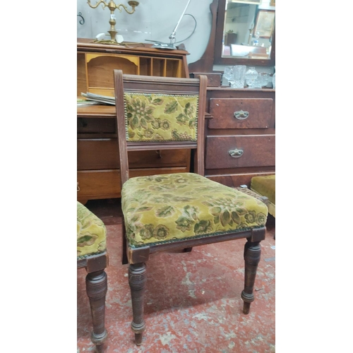 461 - Pair of Victorian dining chairs with floral upholstered seats and backs, featuring turned legs and m... 