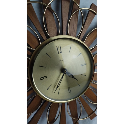 468 - Mid-Century Modern wall clock by Paico with wood and brass sunburst design.