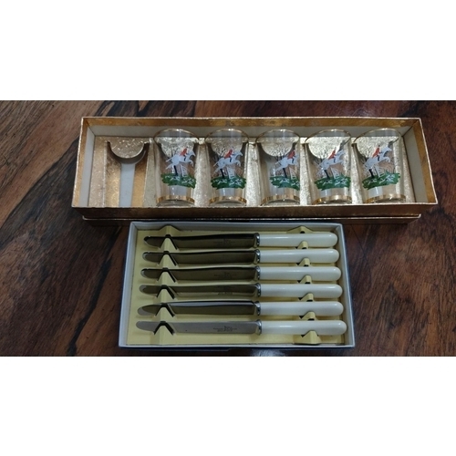 430 - Set of six white-handled knives in original box, accompanied by a boxed set of five drinking glasses... 