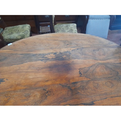 462 - Victorian-era oval tilt-top dining table in rich mahogany with intricately carved pedestal base., me... 