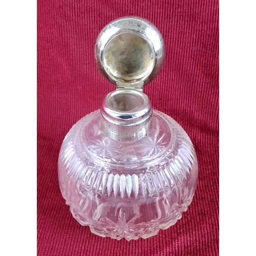 10 - Late Victorian cut glass perfume bottle with a sterling silver collar and cap, Birmingham 1921, mark... 