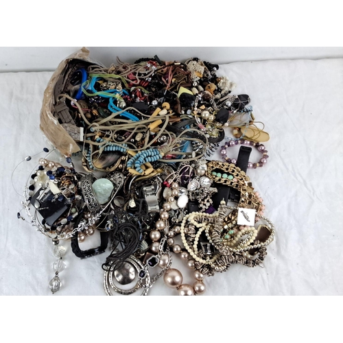 100 - Assorted costume jewelry including necklaces, bracelets, watches, and various accessories. Mixed mat... 