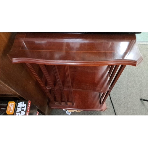 27 - Antique wooden revolving bookcase, mahogany, featuring two-tier shelves and vertical slats.