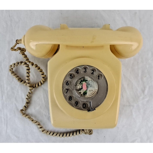 37 - Vintage beige rotary dial telephone from the early to mid-20th century, classic corded design. Featu... 